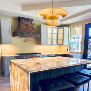 Spacious Kitchen with a Prominent Range Hood and Island