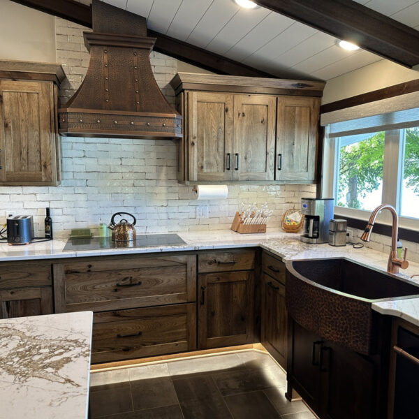 Wood - toned Range Hood in a Well - appointed Kitchen