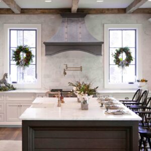 Elegant Range Hood in a Cozy, Wreath - Adorned Kitchen
